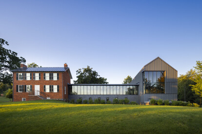 The view from the edge of campus emphasizes the complementary quality of the Federal House's contemporary addition.