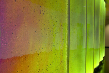 Close Up View of LED Illuminated Glass Wall In Reception Area