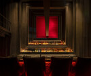 The main bar is designed to give the sense of being great and powerful when sitting at the gray 6.5 meters long marble top bar in front of a wall of gigantic vertical frames.