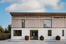 A visually robust form at ground floor with a more lightweight elegant timber structure above