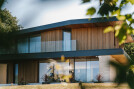 A sustainable home capturing three distinct, far-reaching views