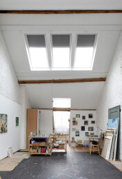 On top of the house, an unused attic became art atelier