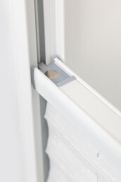 Detail shot of the extended Cord Slide that pushes the cord behind the protecting inner walls of the rails.