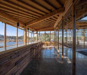 Interior view of community dining spaces facing onto central courtyard and reservoir/village view belvedere