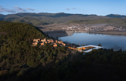 View of campus situated in national park landscape, looking northeast from main hiking trail to Shaxi  Five View of campus in national park landscape looking northwest across reservoir toward historic village of Shilong