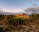 Dune House nestled into the dunes.