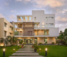 The building transforms with the facade lighting, being complimented with the tastefully designed landscaping elements in the foreground.