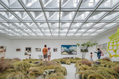 A grid of customized skylight modules creates a highly sculptural gallery ceiling