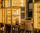 Banker Wire SPZ-52 in Plated Satin Brass featured in the Astra restaurant interior design in San Francisco