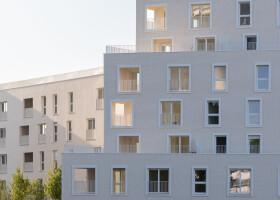 Pointed bricks enhance the facade and presence of a new housing and retail project in Romainville