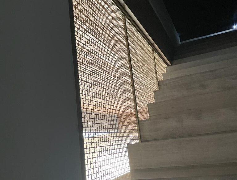 S-40 Woven Wire Mesh in Plated Satin Brass for Staircase Space Divider