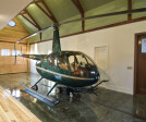Wood Clad Schweiss Hydraulic Door on Helicopter Carriage House