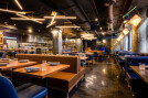 Modern meets comfort in this chic dining space, where warm lighting and sleek geometric lines blend to create an inviting atmosphere perfect for a casual lunch or an elegant dinner affair.