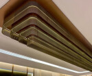 TW-1 Woven Wire Mesh in Antique Brass installed as a Ceiling Feature