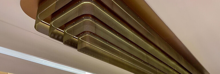 TW-1 Woven Wire Mesh in Antique Brass installed as a Ceiling Feature