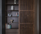 the bookcase with sliding walnut shutters