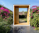 12. Entry to the private cottages framed by Bougainvillea