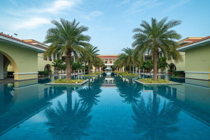 The vast reflecting pool at the entrance provides a stunning panorama of the pool area the golf course