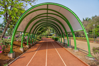 Jogging track covered by a tensile roof