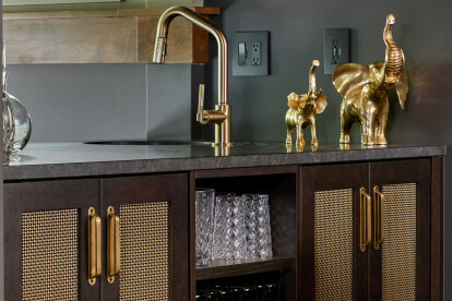 Kitchen remodel installed beautiful new walnut cabinets adorned with Banker Wire’s S-12 woven wire mesh in a plated Antique Brass finish