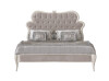 Luxurious Velvet Queen Bed with Ornate Headboard and Detailed Accents