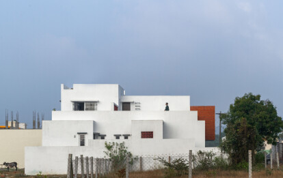 House with the existing neem tree on the north side