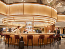 The luxurious Chase Sapphire Lounge inside LaGuardia airport features the Banker S-9 decorative wire mesh in a bare brass finish adding texture and elegance to their light features.