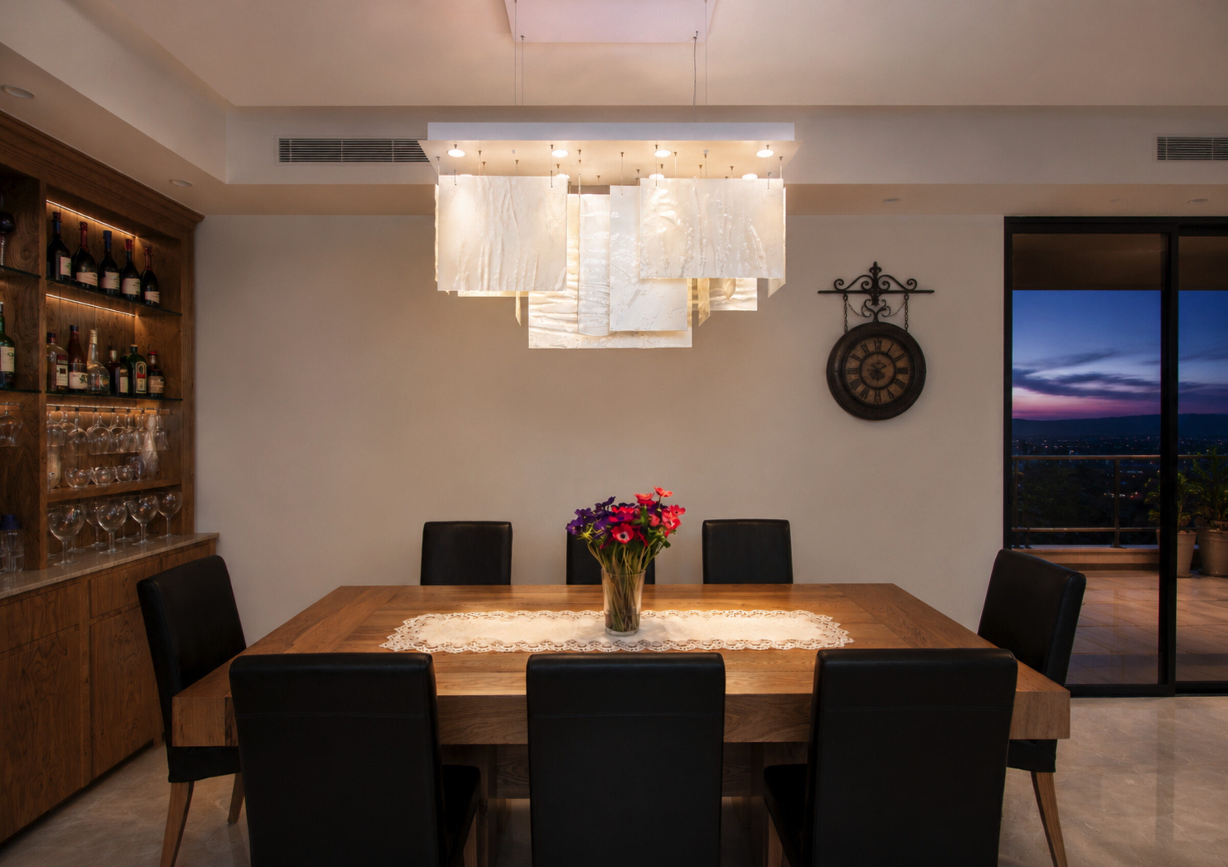 Tailored to the dining space, layered architectural glass creates a soft sculptural volume - with proportions, canopy size, glass textures and composition individually designed to suit each project.